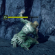 A fantasy warrior covered in green poison grovels near a rocky wall.